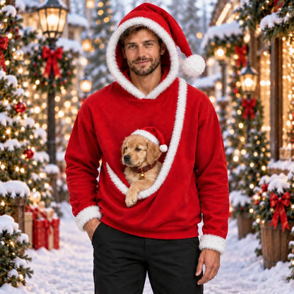 Man wearing the Santa pet pouch hoodie with a golden retriever puppy in the pouch